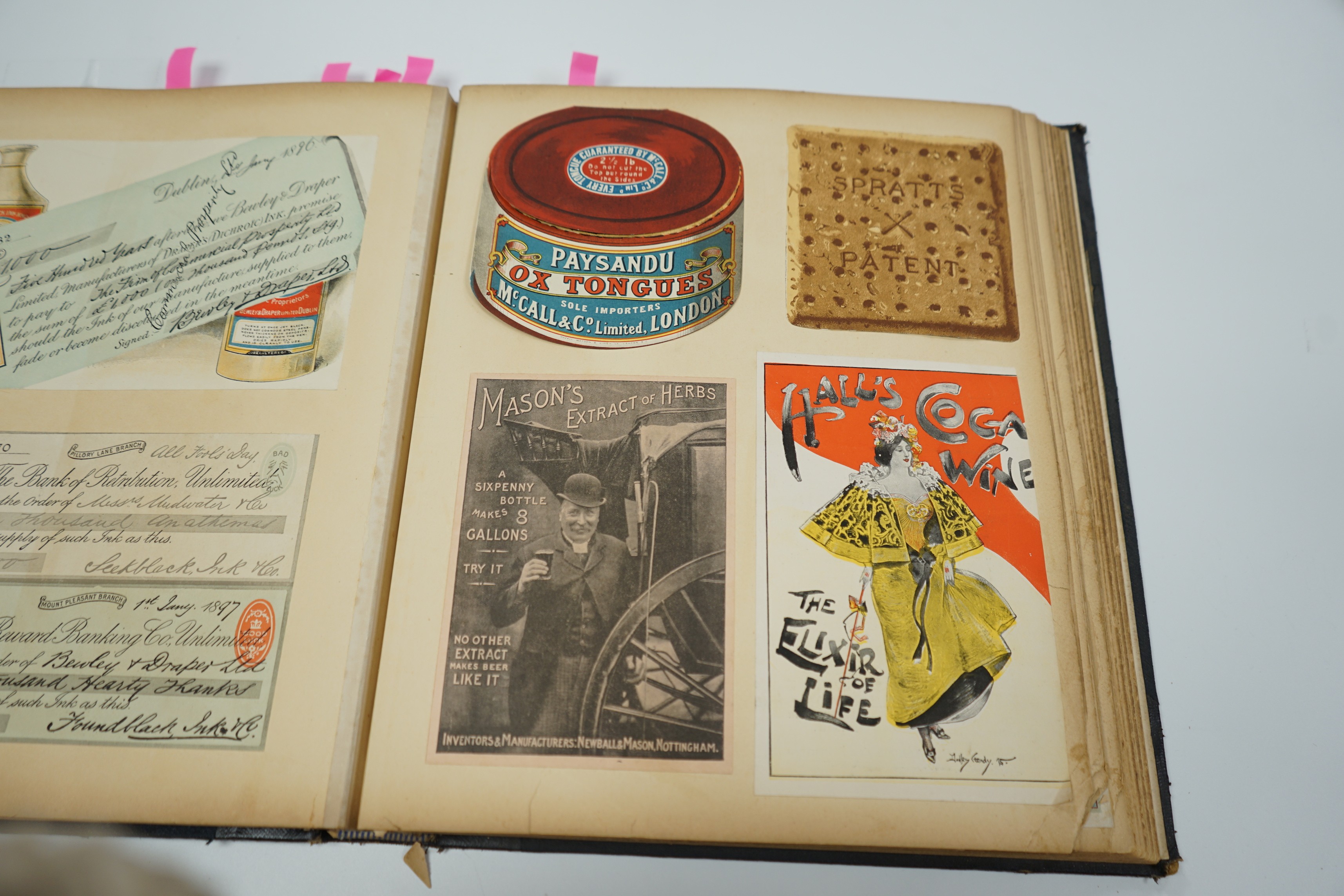 An early 20th century postcard album and a similar advertising album